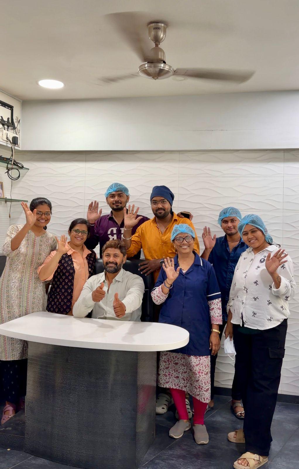 Our team welcoming you to the clinic Dr. Varun and the clinical team welcoming patients at Dr. Varun's Dental Clinic in Odhav, Ahmedabad