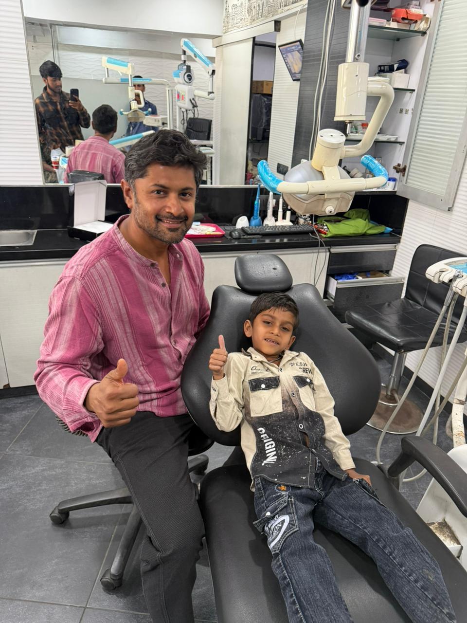 Gentle pediatric dental care Dr. Varun providing gentle pediatric dental care to a young patient in Ahmedabad
